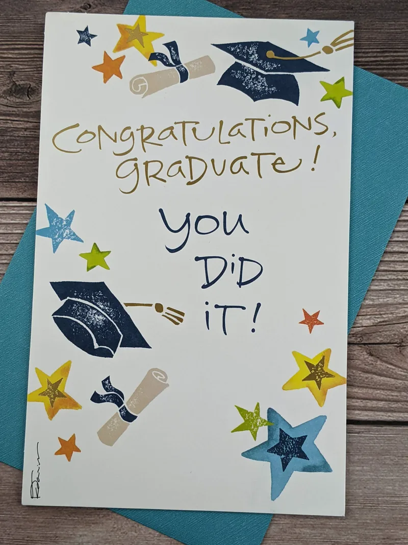 A graduation greeting card with a white background, featuring images of stars, diplomas, and blue graduation caps.