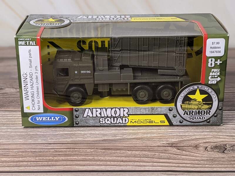 A Green and Gray Pull Back, Die Cast Metal Armor Squad Model Truck Toy by Welly.
