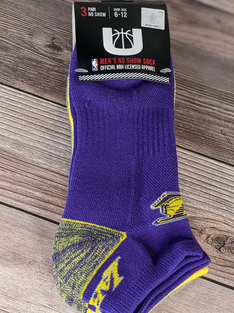 Three pairs of new socks featuring the LA Laker's logo with purple, yellow, and gray designs.