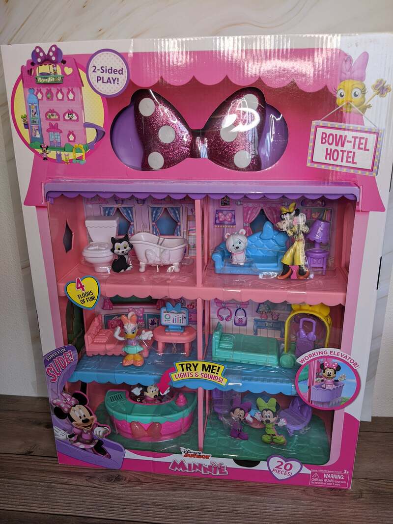 A large Disney themed toy, the Minnie Bow-Tel Hotel doll house with accessories.