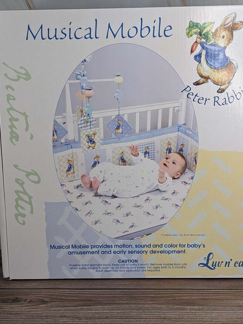 A musical crib mobile with motion, featuring Peter Rabbit by Beatrix Potter.
