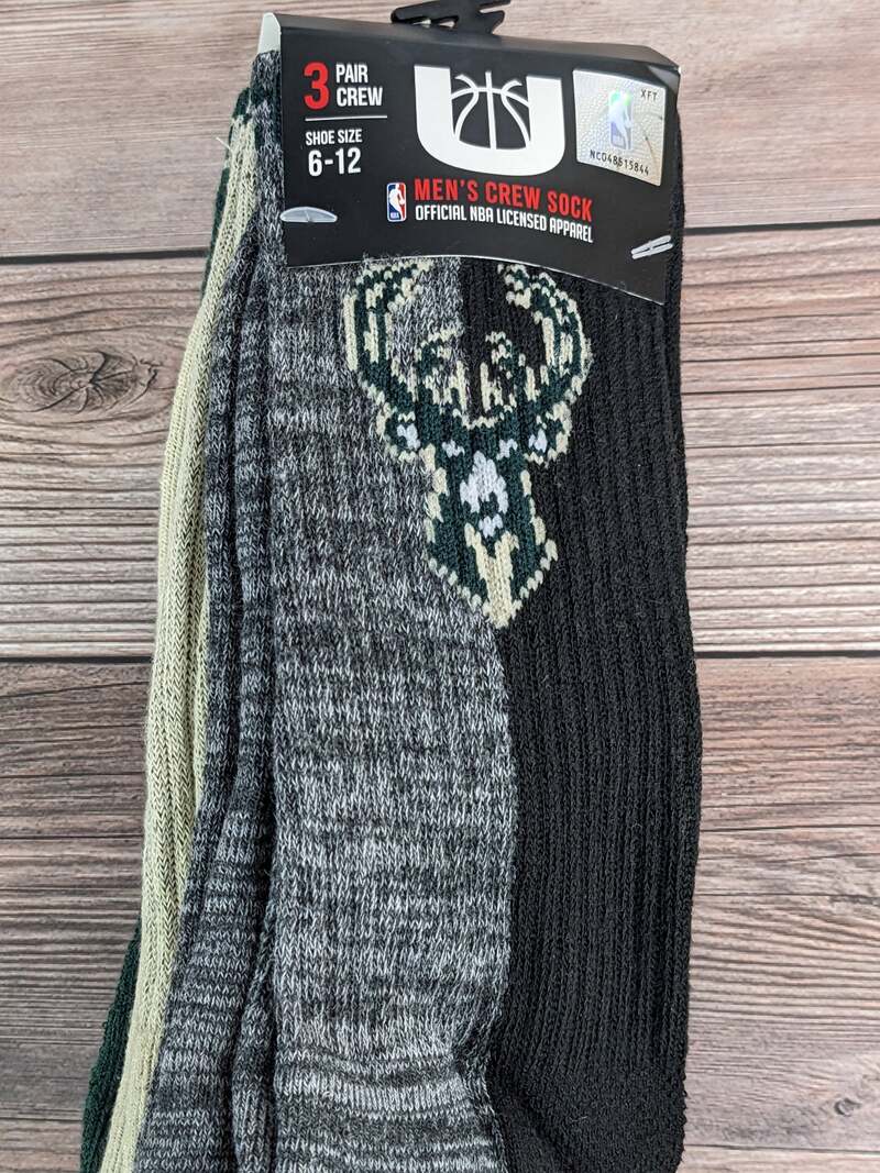 A pack of Gray/Black, Tan/Green, and Black/Green Color-Block Crew Socks for MEN, with the NBA Milwaukee Bucks logo.