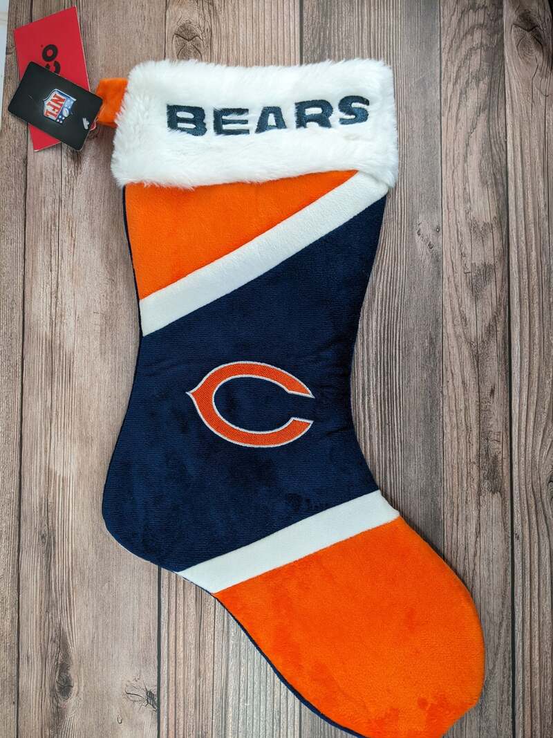 An orange, navy-blue and white NFL Christmas stocking with the Chicago Bears logo.