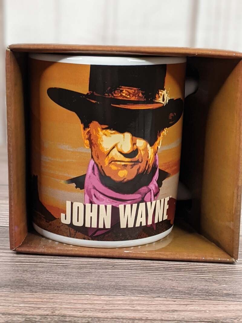 A John Wayne themed gift mug with an image of John and a quote by him.